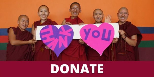 Group of Tibetan Buddhist nuns holding a thank you sign, 2021 message