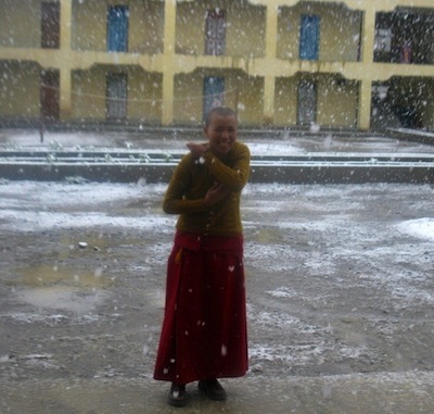 Buddhist nun in snow at Sherab Choeling Nunnery Spiti