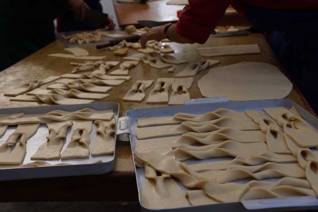 The nuns make extra large Tibetan khapse for the altar