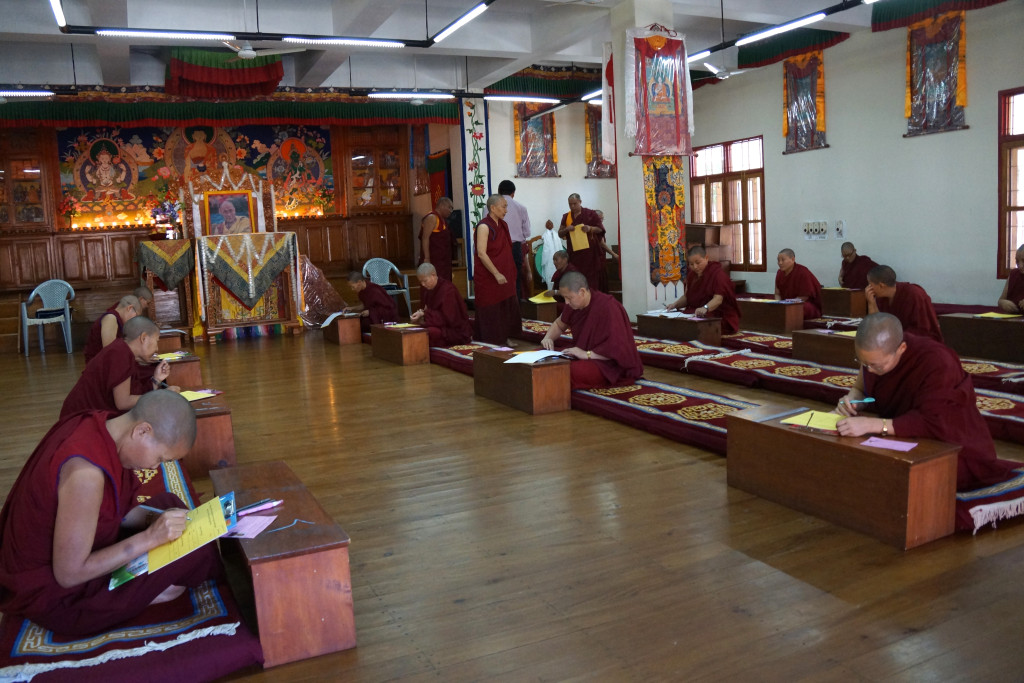 Tibetan Buddhist nuns sitting round 2 of Geshema exams