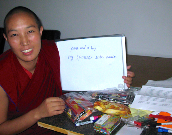 Buddhist nun holding note of thanks