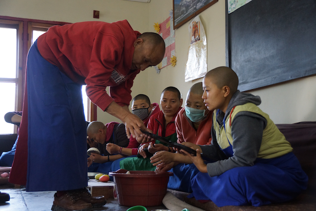 Tibetan nuns at Dolma Ling learning how to make butter sculpture