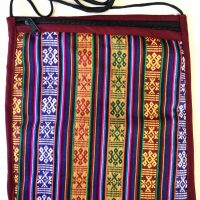 Bhutanese Fabric Bag is handmade and made with traditional bhutanese fabric, measuring 8″ x 10" with nylon crossbody strap and a zipper closure