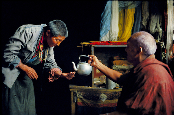 Brian Harris, Tibet, nun receiving blessed water, 