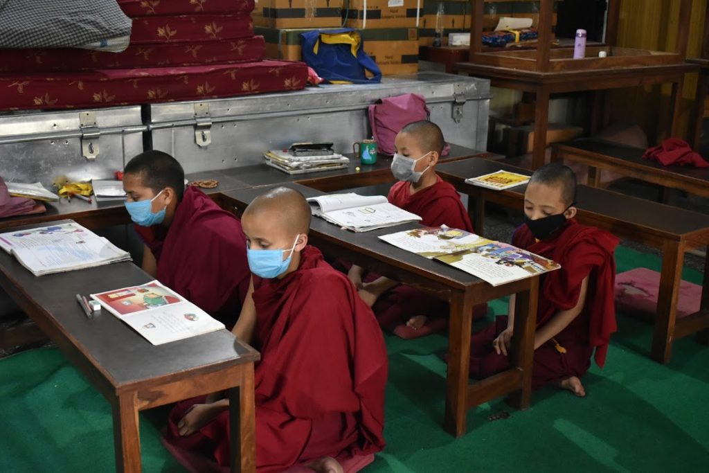 Tibetan Buddhist nuns wearing masks