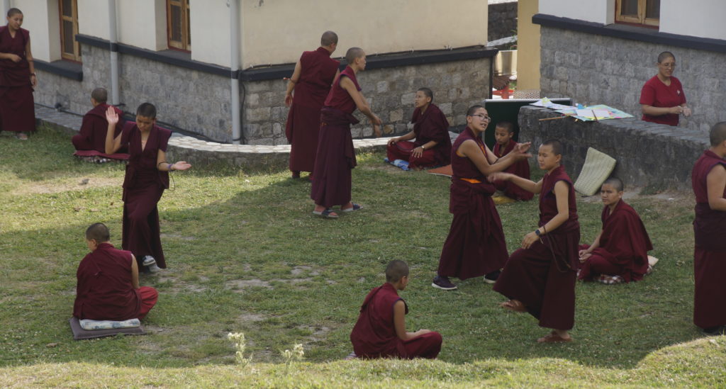 Tibetan Buddhist nuns debating at Dolma Ling, Tibetan monastic debate, debate courtyard extension
