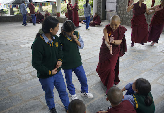 Geshema Delek Wangmo teaching TCV students about monastic debate Sept 2023