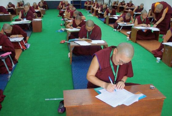 Rows of Tibetan Buddhist nuns taking Geshema exams in 2025