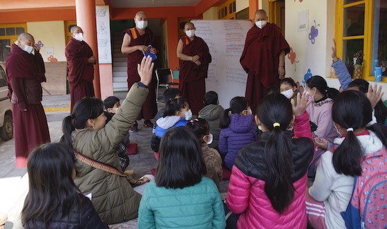 Geshemas teaching Tibetan children Feb 2022