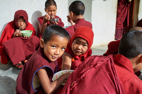young Tibetan Buddhist nuns at Sherab Choeling Nunnery eating