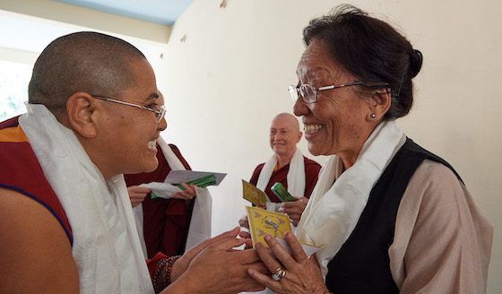Rinchen Khando Choegyal congratulates one of the 20 Geshemas in 2016, Olivier Adam