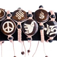 Macrame Bracelets are made of adjustable hand-woven macrame featuring painted traditional Tibetan designs and polished wooden beads, made by Tibetan Buddhist nuns