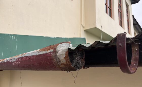 Temple roof repair rusted gutters
