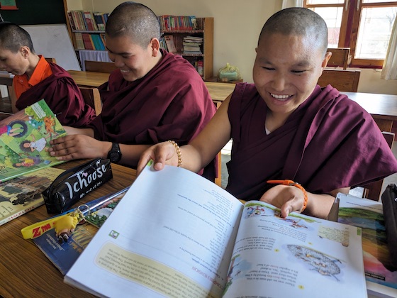 Tibetan Buddhist nuns with new textbooks