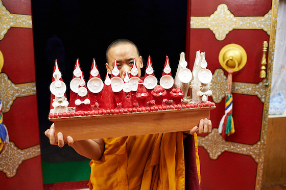 Tibetan Buddhist nun holding torma