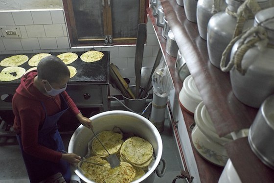 Tibetan Buddhist nuns cooking breakfast