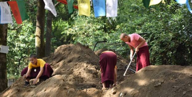 Tibetan Buddhist nuns at Shugsep fixing leaking pipes