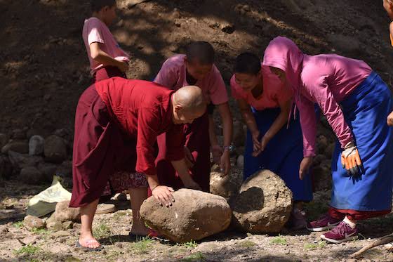 Tibetan Buddhist nuns at Shugsep repairing leaking pipes