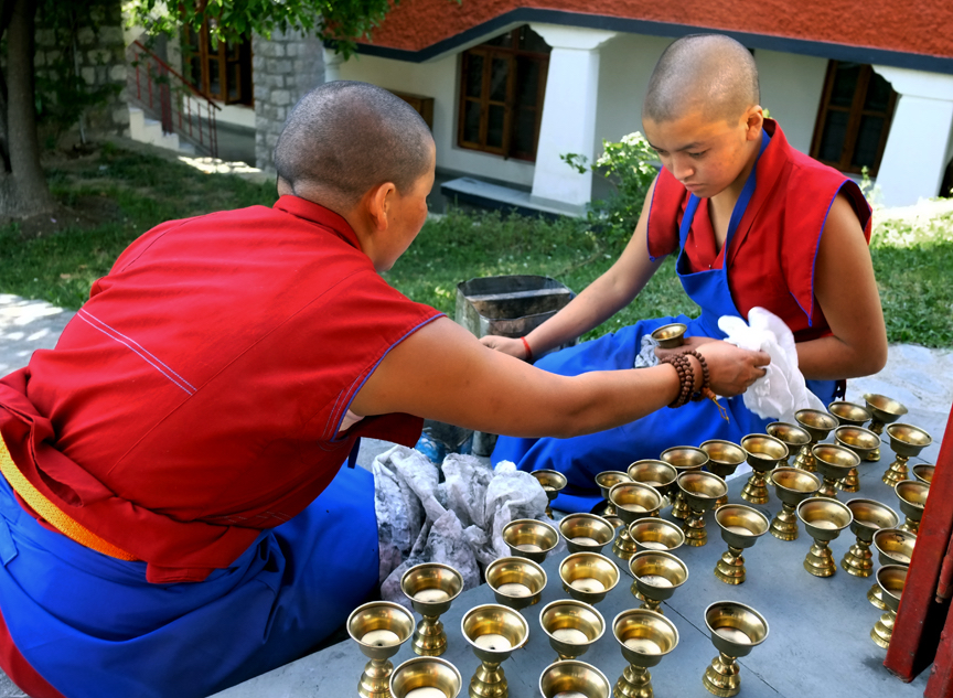 butter lamps, pujas, Tibetan nuns