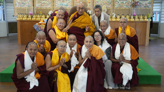 His Holiness the Dalai Lama blesses the Geshema nuns who have completed their further studies in Tantric Buddhism.