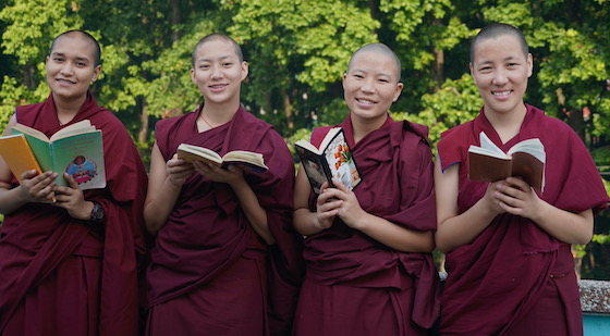Tibetan Buddhist nuns with books
