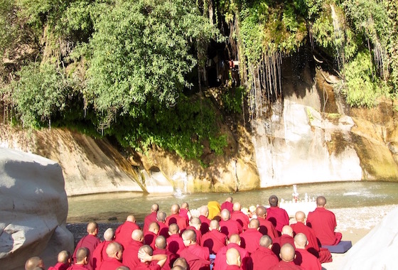 Tilokpur nuns praying opposite Tilopa's cave, Tilopa, Tilokpur
