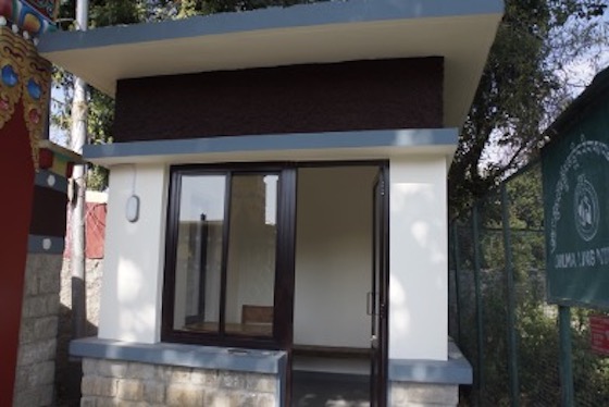 Completed watchman hut at the entrance to Dolma Ling Nunnery