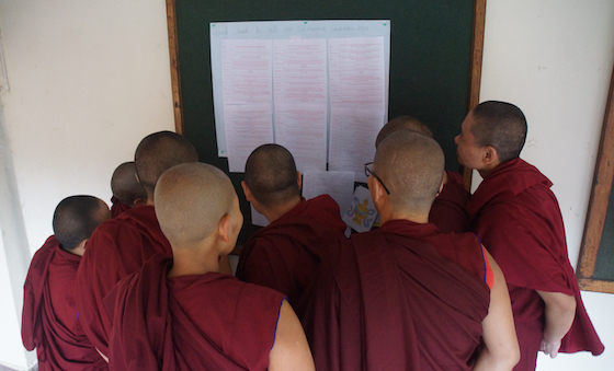 Tibetan Buddhist nuns read good luck messages Geshema exams