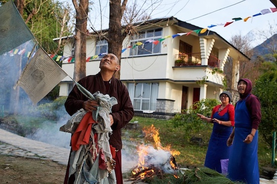 burning old Tibetan prayer flags