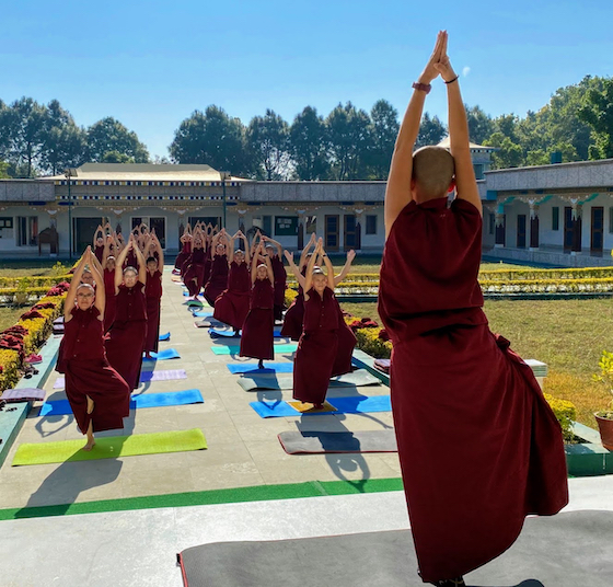 photo of Tibetan Buddhist nuns doing yoga from 2022 charity calendar