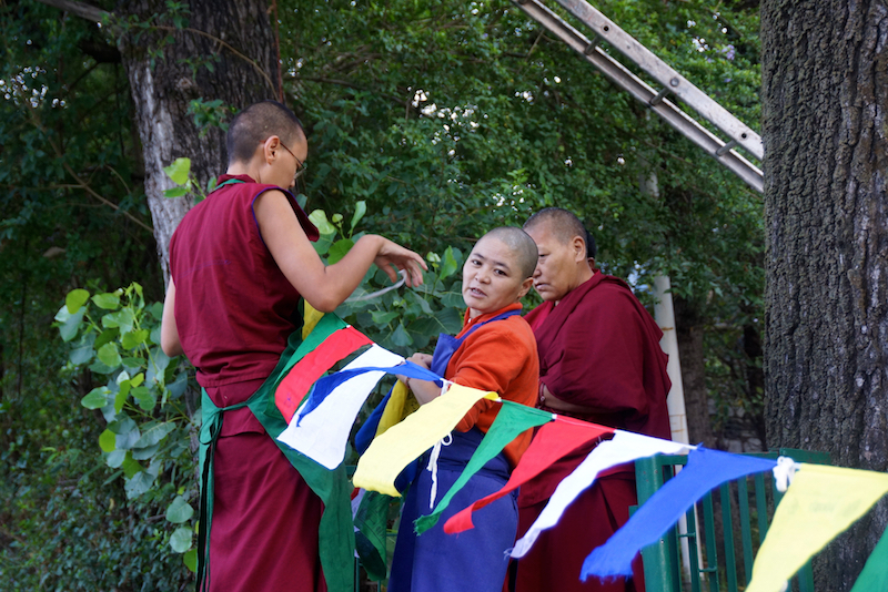 hanging prayer flags, Tibetan Buddhist holidays, Tibetan Nuns, Universal Prayer Day
