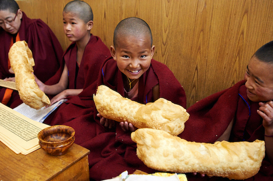 Young Tibetan Buddhist nuns holding Losar khapse